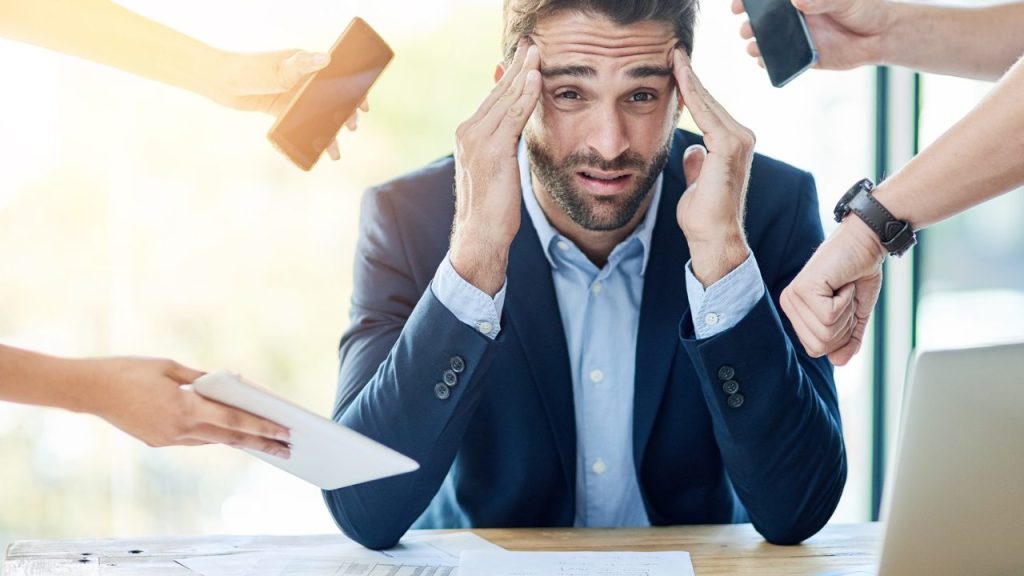 a-stressed-virtual-assistant-feeling-overwhelmed-with-too-many-tasks-reflecting-the-demanding-nature-of-their-role-in-providing-administrative-support-remotely
