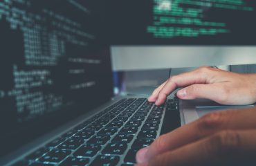 programming-and-web-development-on-laptop-and-imac-computers