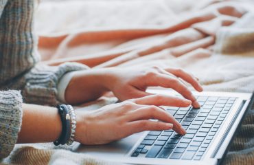 virtual-content-writer-typing-on-laptop